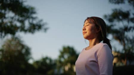 Young Asian Woman Relaxing In Nature.