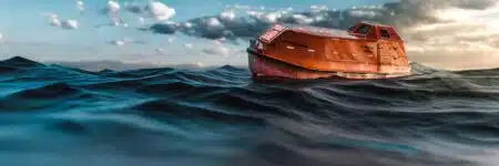 Orange,emergency,life,boat,in,the,ocean,waiting,to,be